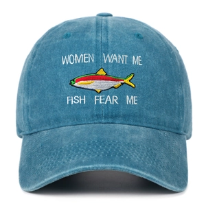 Close-up of fishing embroidery details on a washed denim baseball cap with funny slogan