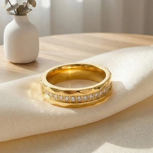 Detailed macro view of gold titanium ring with hammered texture and pave zircon row