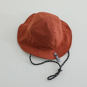 Quick-dry kids bucket hat in brick red with adjustable chin strap for outdoor sun protection
