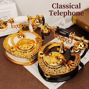 Vintage rotary phone music box with heart-shaped base and rose relief in black gold