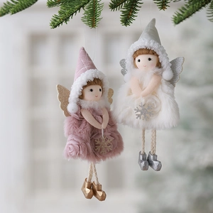 Christmas plush angel pendants with wings and gold boots hanging on pine branches