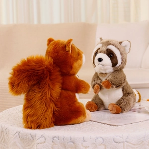 Adorable plush squirrel and raccoon stuffed animals sitting on a white lace table