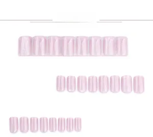 Macro detail of short square light pink cat-eye press-on nails with shimmering glitter
