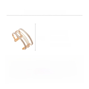 Detailed view of gold multi-layer iron cuff bracelet with fine glitter finish and open design