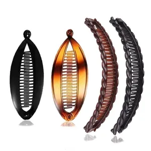 Detailed view of resin banana hair clips with interlocking teeth and clasp closure