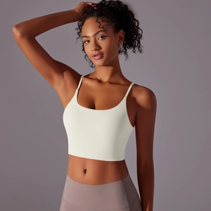 Detail view of the cream-colored high-impact sports bra with thin straps and U-neckline