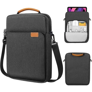 Gray fabric laptop bag with brown leather handles and adjustable black shoulder strap