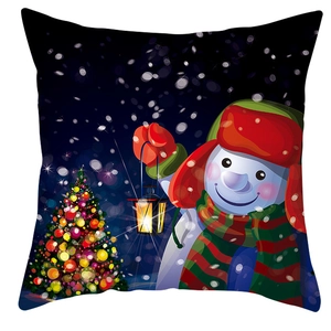 Close-up of snowman with lantern and Christmas tree on blue snowflake pillow case