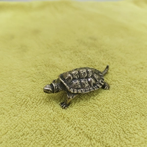 Handcrafted brass turtle figurine with detailed shell texture for tea pet decoration