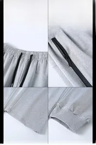 Detalles del pantalón de chándal gris claro con cordón ajustable y bolsillos con cremallera