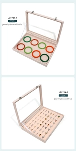 Beige velvet jewelry storage boxes with glass lids showing bracelet and ring compartments