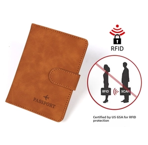 Brown leather passport holder with RFID blocking and secure snap closure detail