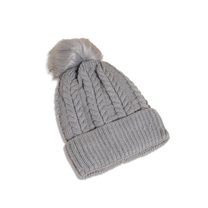 Detail of grey cable knit beanie featuring a fluffy pom-pom and ribbed texture