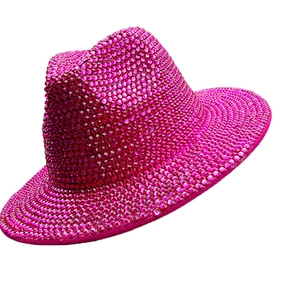 Close-up of sparkling pink rhinestones on a stylish luxury disco jazz hat texture