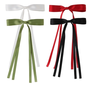 Set of four satin bow hair clips in white, olive green, red, and black with long ribbons