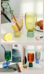 Detail of colorful heat-resistant borosilicate glass cups with contrast stems and straws