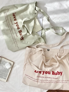 Large canvas tote bag with red letter print in mint green and beige colors