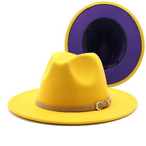 Detail showing two-tone contrast design of yellow wool fedora with purple interior