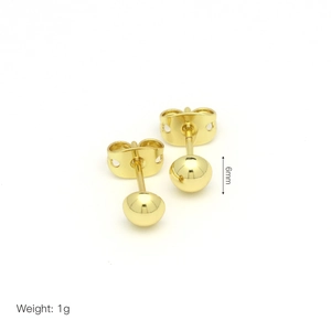 Detailed view of 6mm golden ball earrings with 1g weight and polished metal finish