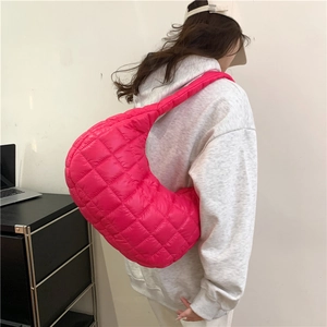 Fuchsia quilted cloud dumpling shoulder bag with padded fabric in a stylish casual style