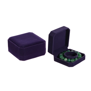 Detail view of open and closed dark purple velvet jewelry boxes for bracelets and bangles