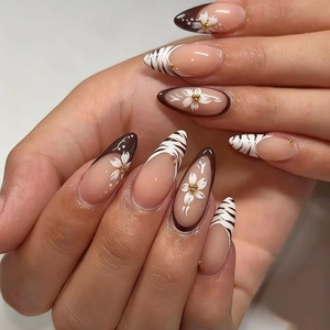 Long almond press-on nails with brown floral designs and zebra patterns in 10-piece set