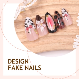 French almond fake nails with zebra patterns, 3D floral accents and glitter details
