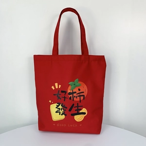 Close-up of red canvas wedding gift bag with GOOD LUCK print and persimmon pattern