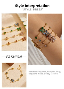Detailed close-up of gold stainless steel butterfly bracelet with colorful gemstones