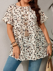 Close-up of leopard print fabric detail on bohemian style short sleeve tunic top