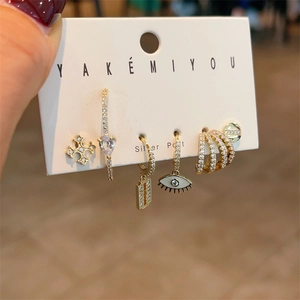 Detailed set of six gold-tone earrings featuring silver posts and zircon heart motifs