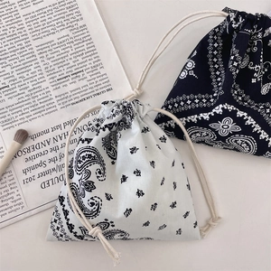 Detail of paisley print drawstring storage bags in cotton linen for small items