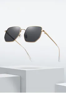 Macro detail of large hexagonal metal sunglasses frame with stylish grey polarized lens