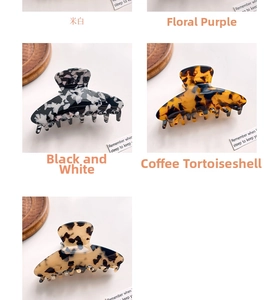 Detail showing four acetate hair claw clips in tortoise, floral, and marbled patterns