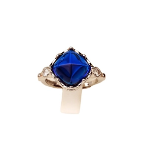 Luxury sapphire blue sugarloaf stone ring with brilliant side diamonds in silver