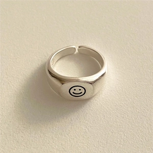 Minimalist S925 sterling silver open ring featuring a polished finish and smiley face engraving