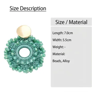 Detailed sizing of green beaded earrings with 7cm length and 5.5cm width dimensions