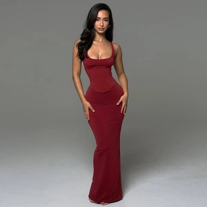 Detail of red floor-length bodycon dress featuring corset-style bodice and vertical stitching