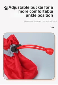 Detail showing adjustable buckle and elastic drawstring on red reflective dog boot