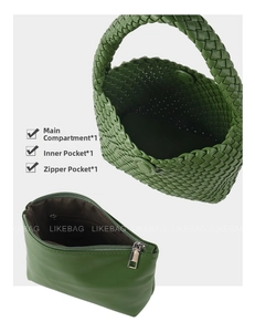 Detail view of woven green tote bag showing main compartment and zippered inner pouch