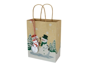 Detail of kraft paper Christmas gift bag with snowman pattern and festive tag