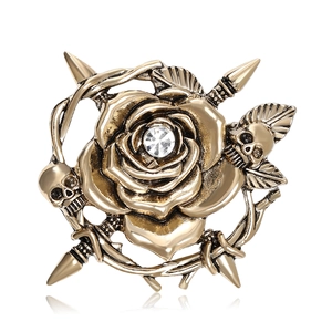 Vintage gold skull and rose brooch with thorn wreath and crystal in center