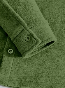 Detailed macro view of olive green tactical fleece jacket sleeve with buttoned cuffs