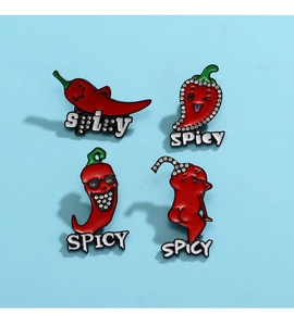 Detail of creative red chili pins with funny facial expressions and spicy text logo