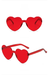 Front and side view of red heart-shaped rimless sunglasses with jelly texture
