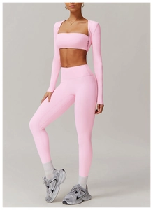 Detailed view of pink yoga set fabric texture with seamless high-waist fit leggings