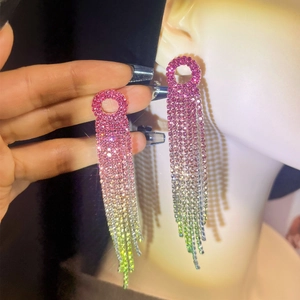 Macro view of long rhinestone tassel earrings with pink yellow and green gradient color