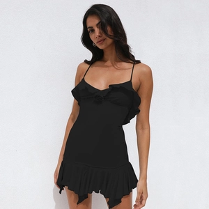 Detail of the black mini dress with elegant ruffles, thin straps and high waist backless cut