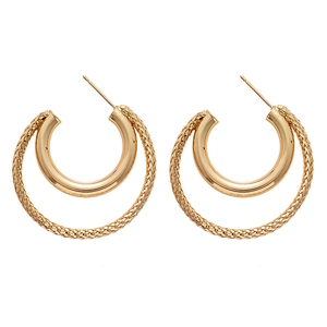 Minimalist double-layered gold C-shape hoop earrings with smooth and braided metal textures