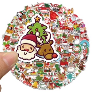 Close-up of waterproof Christmas stickers with Santa, reindeer and tree patterns